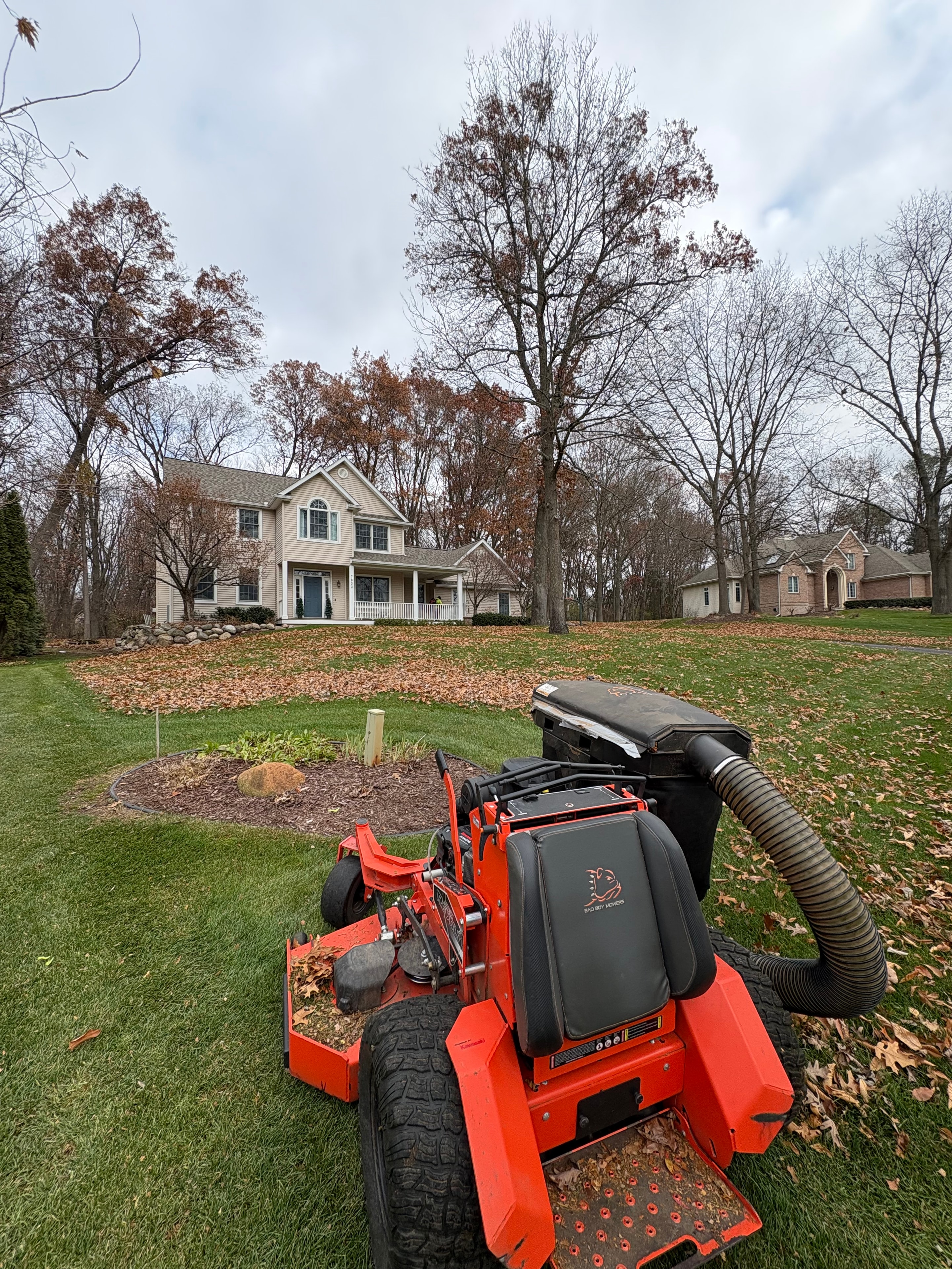 Leaf collection in full swing — clearing every corner before the Michigan winter sets in.