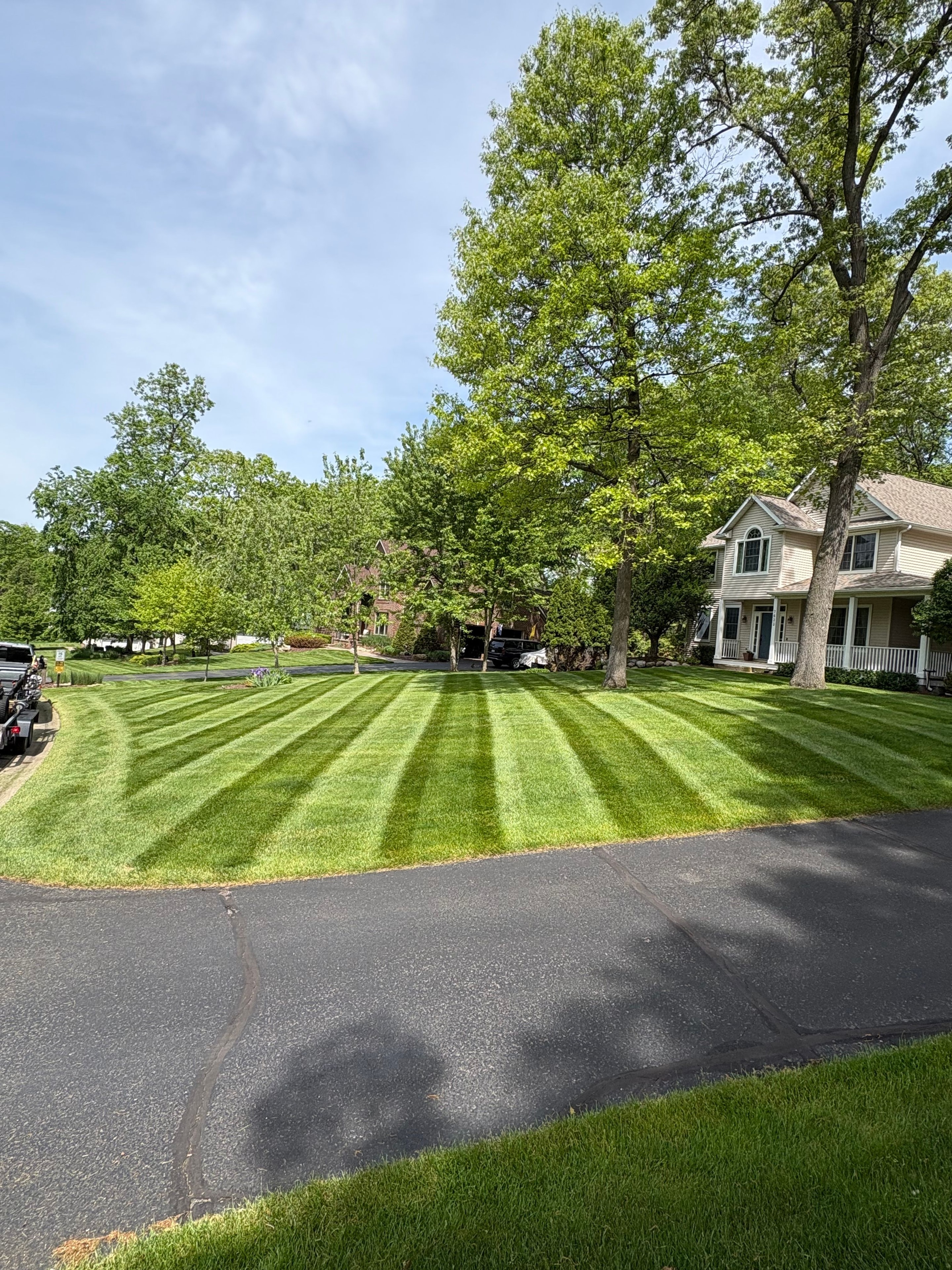 Fan-pattern stripes radiating out from a circular driveway — precision at its best.